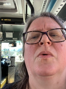Me on the bus, looking perplexed, because the electronic message board is behind me